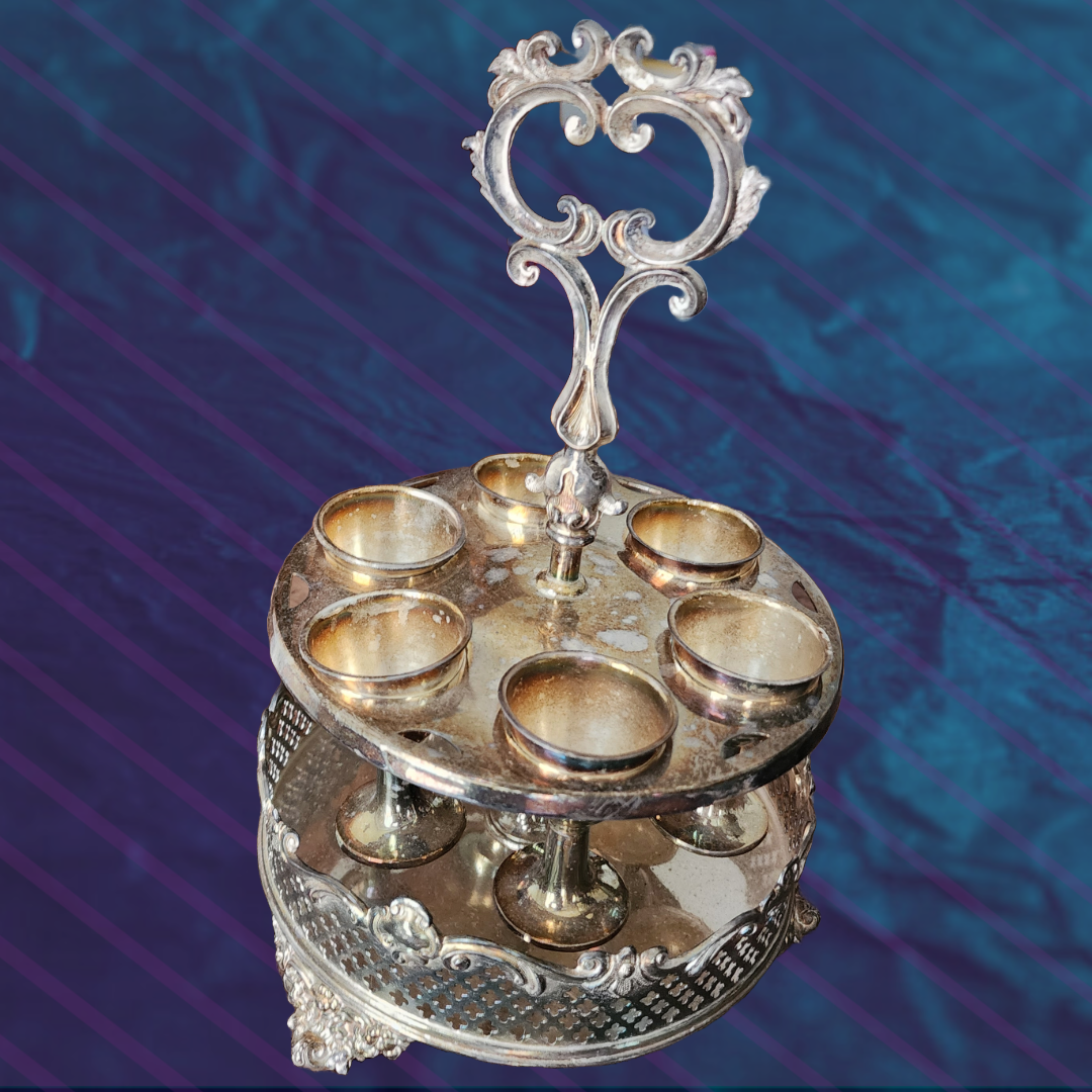 Antique Egg Cup Holder with intricate silver detailing and six egg cups