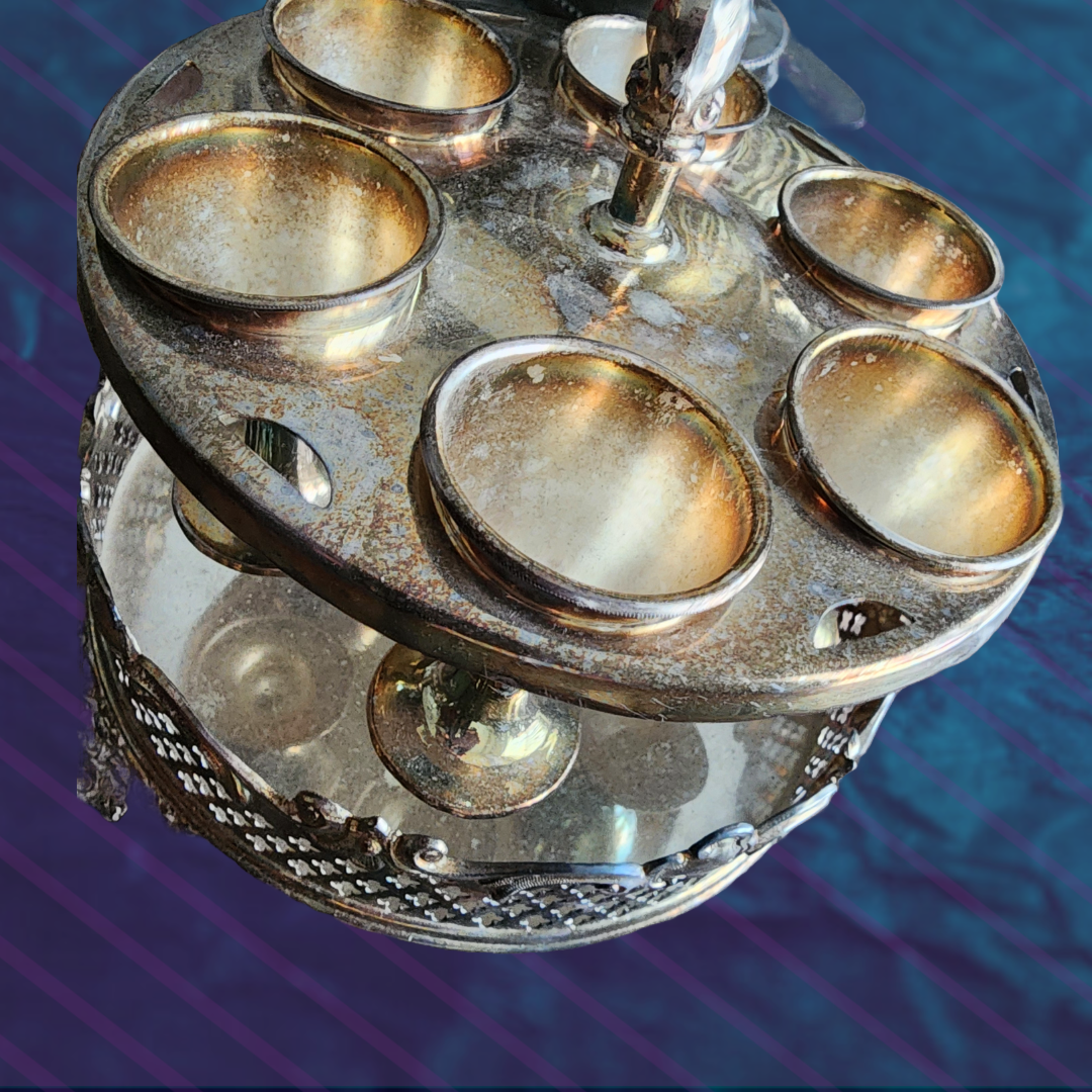 Antique Egg Cup Holder with intricate silver detailing and six egg cups