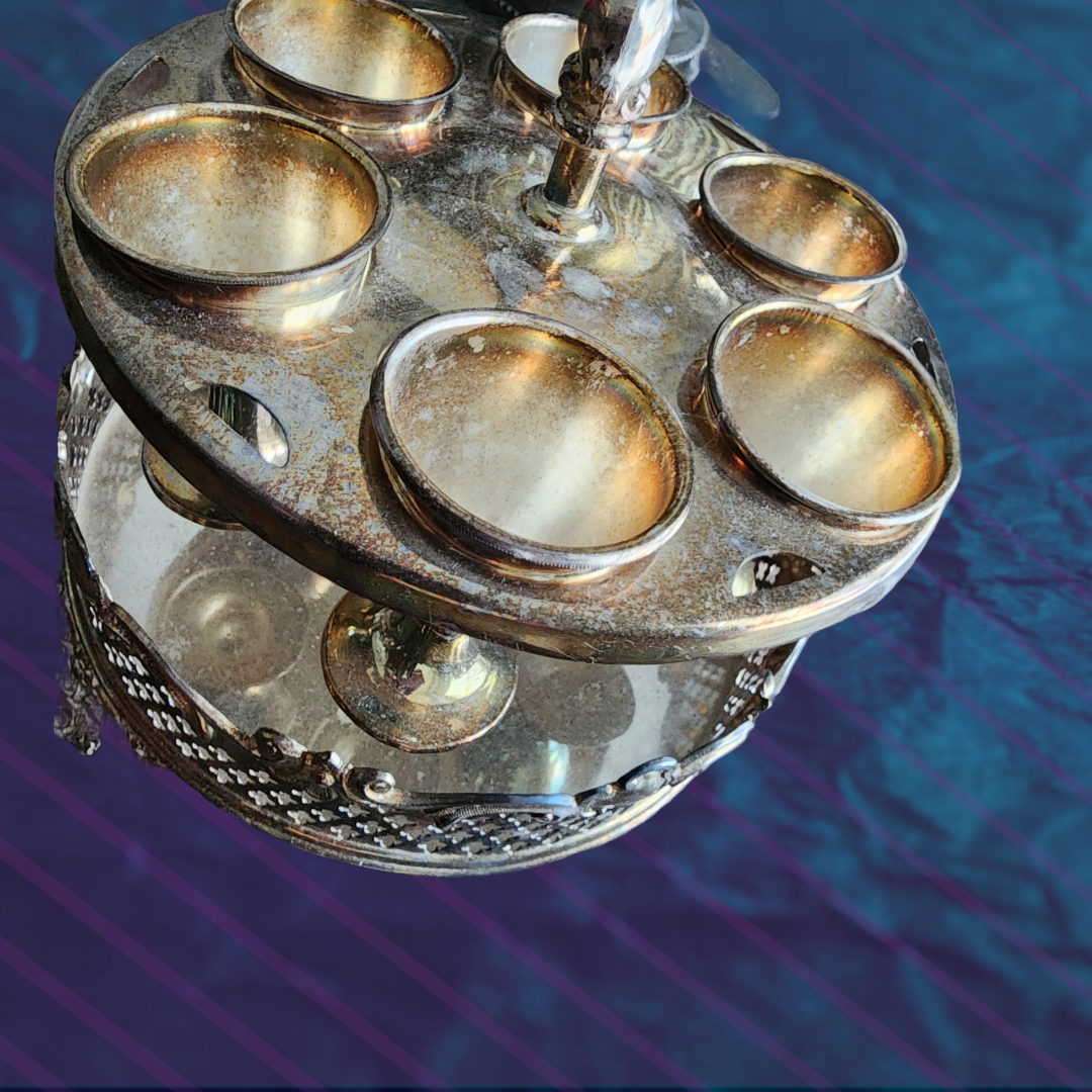 Antique Egg Cup Holder with intricate silver detailing and six egg cups