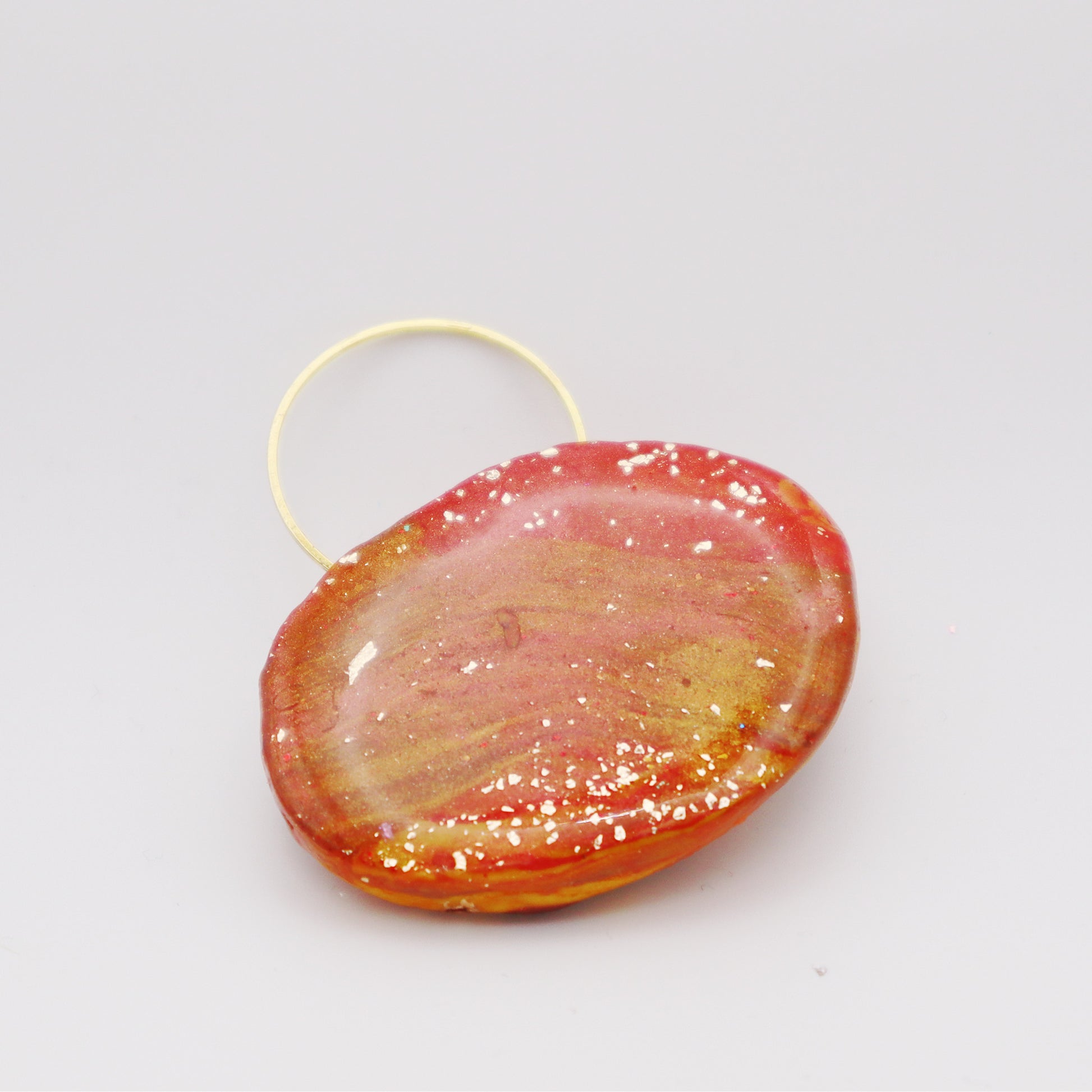 Amber Flame Polymer Clay Pendant with warm amber hues and handcrafted design