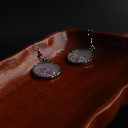 Lavender gemstone earrings in clear resin and silver frame with delicate lavender stones 