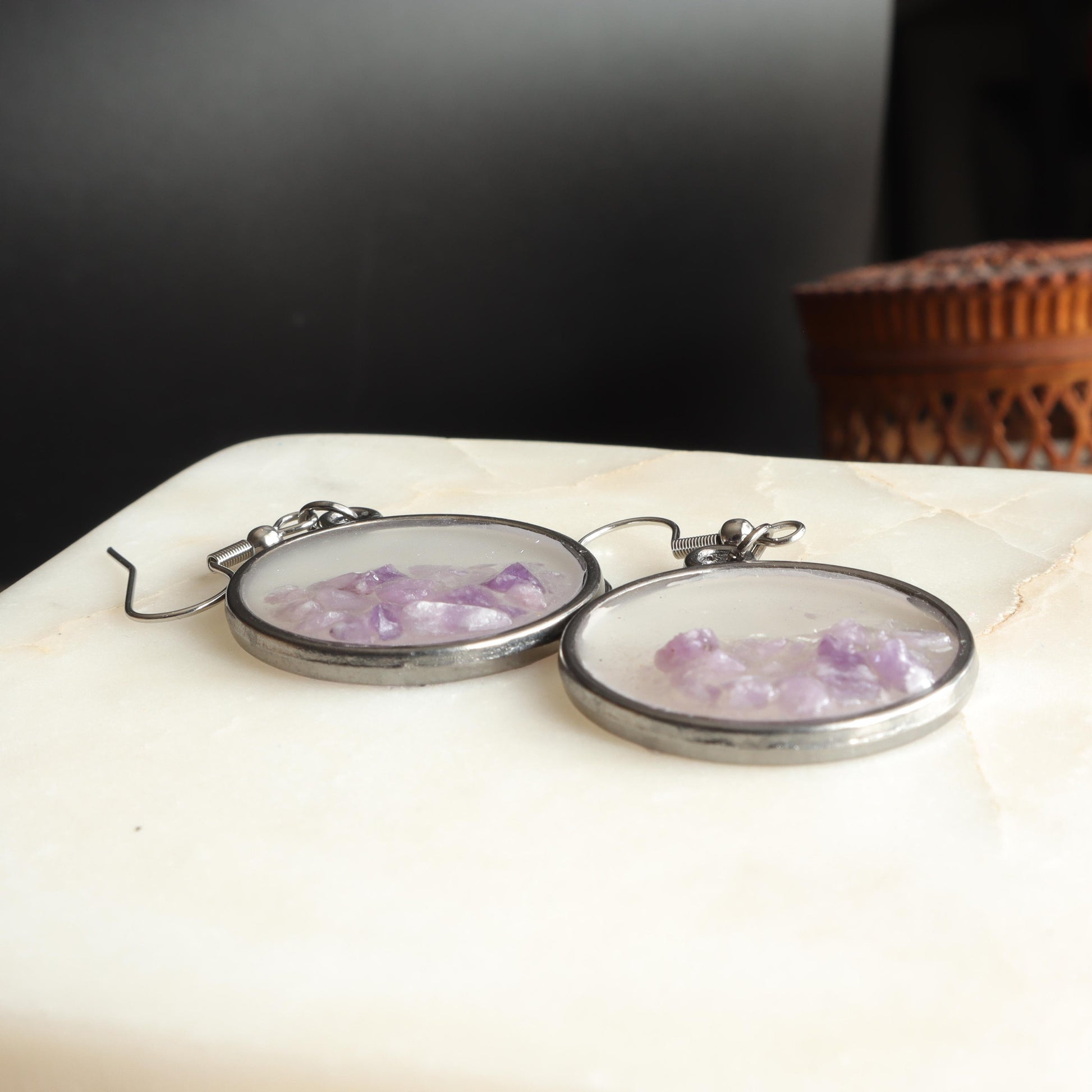 Lavender gemstone earrings in clear resin and silver frame with delicate lavender stones 