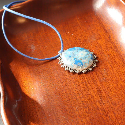 Blue Floral Polymer Clay Pendant with intricate silver frame and matching blue cord