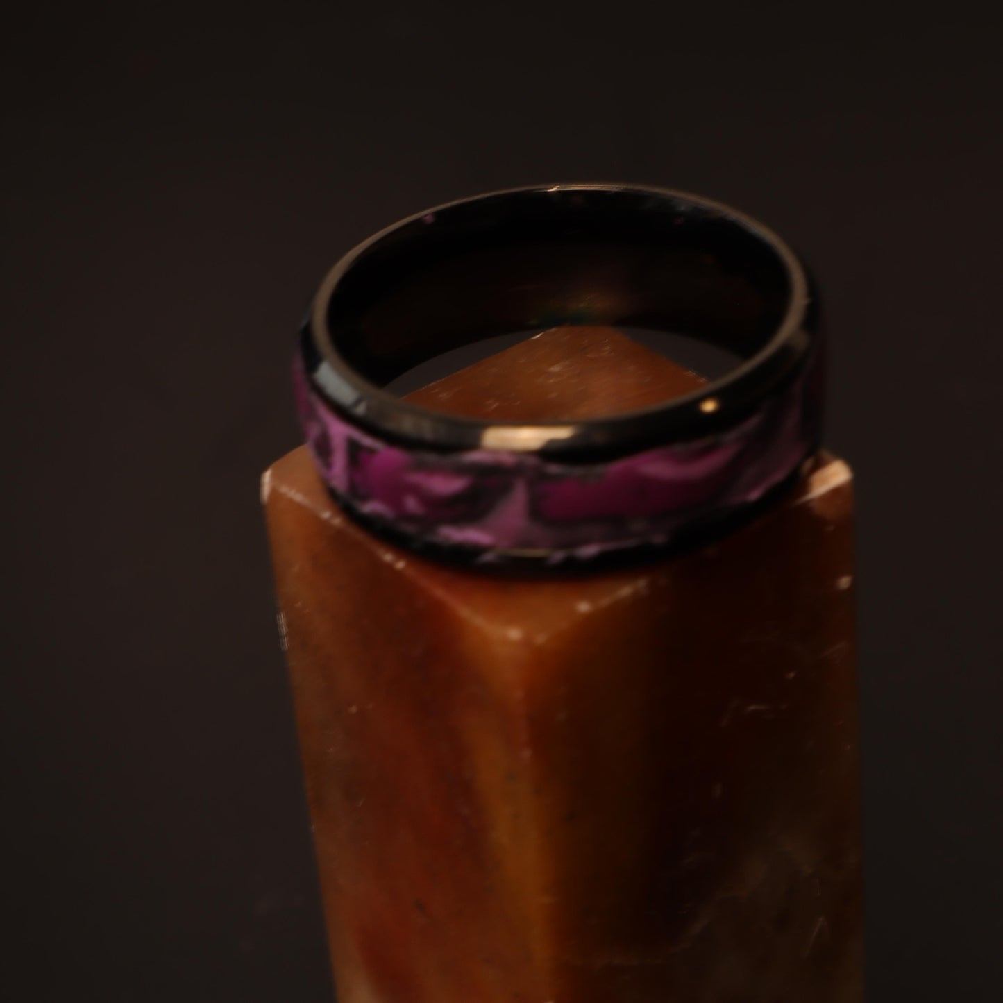 Black resin ring with a marbled orchid purple design