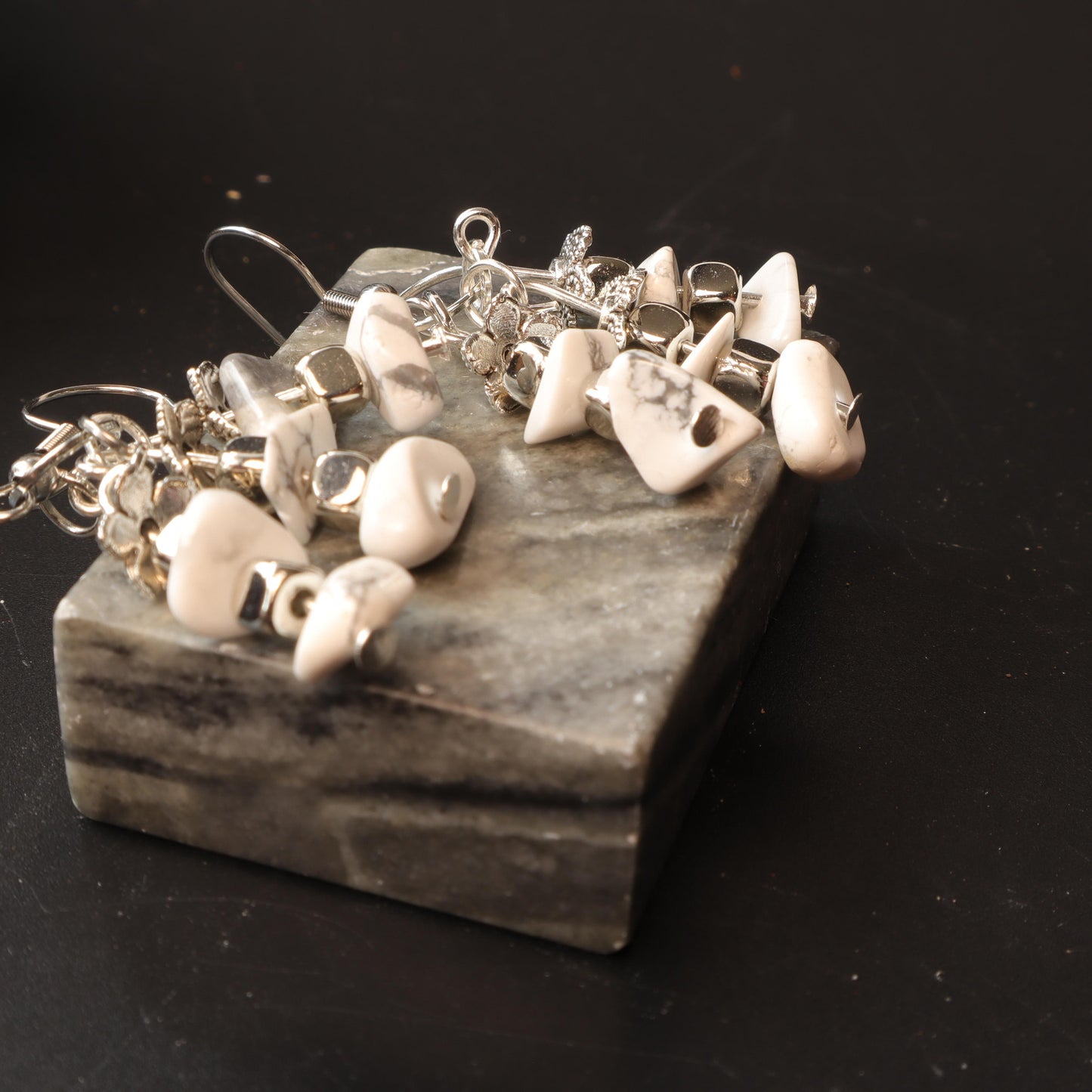 Dangling earrings with natural white marbled stones and silver-tone accents