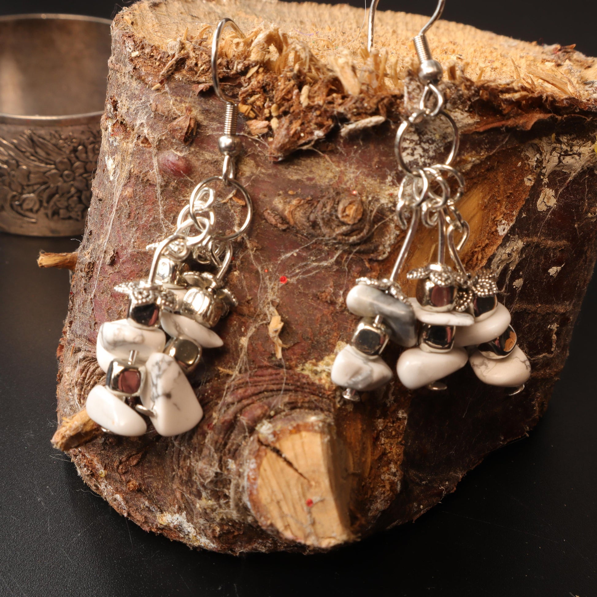 Dangling earrings with natural white marbled stones and silver-tone accents