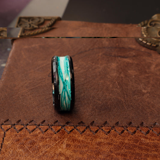 Black resin ring with a turquoise marbled inlay featuring blue and white accents