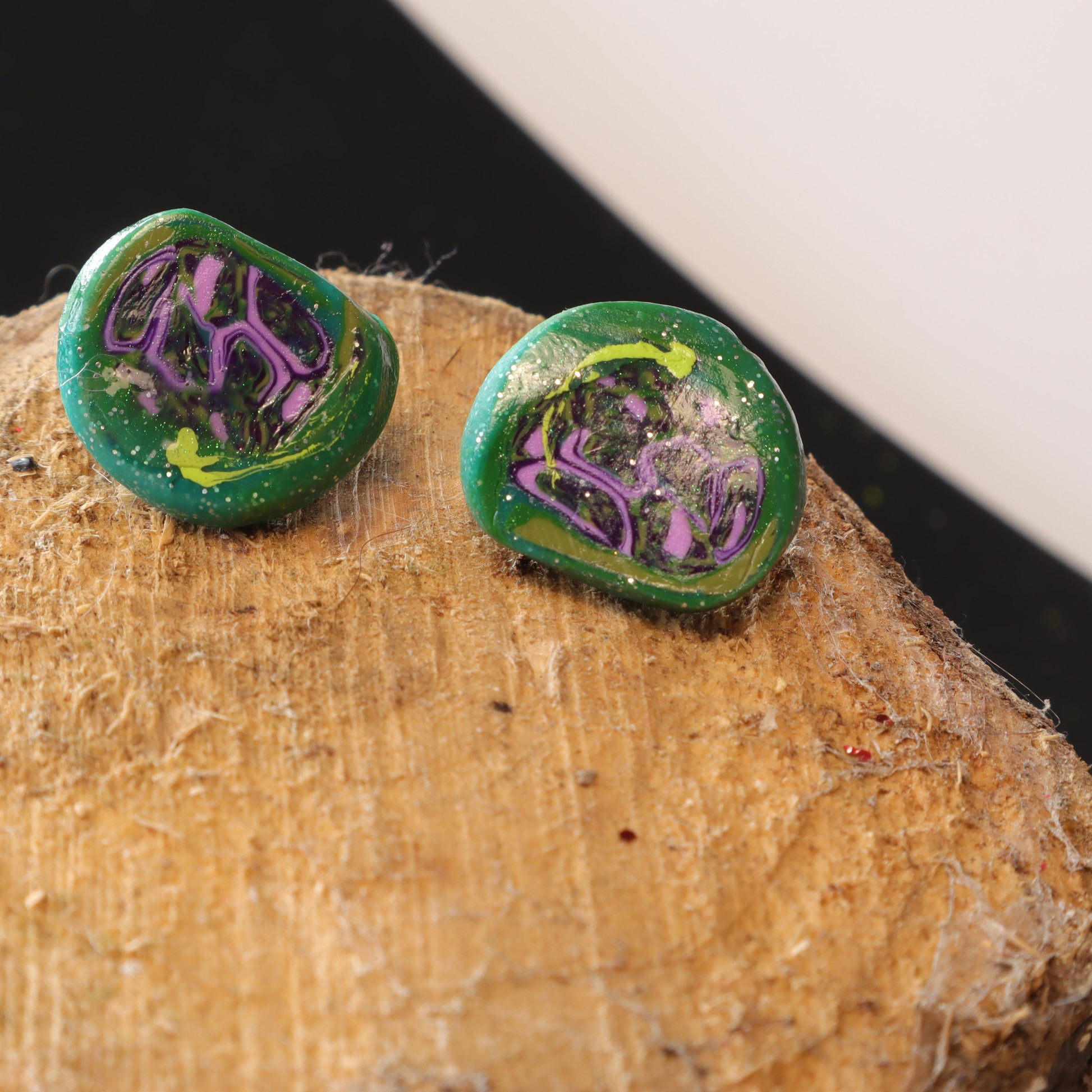 Handmade polymer clay earrings in vibrant blue and green shades, with sparkling embellishments